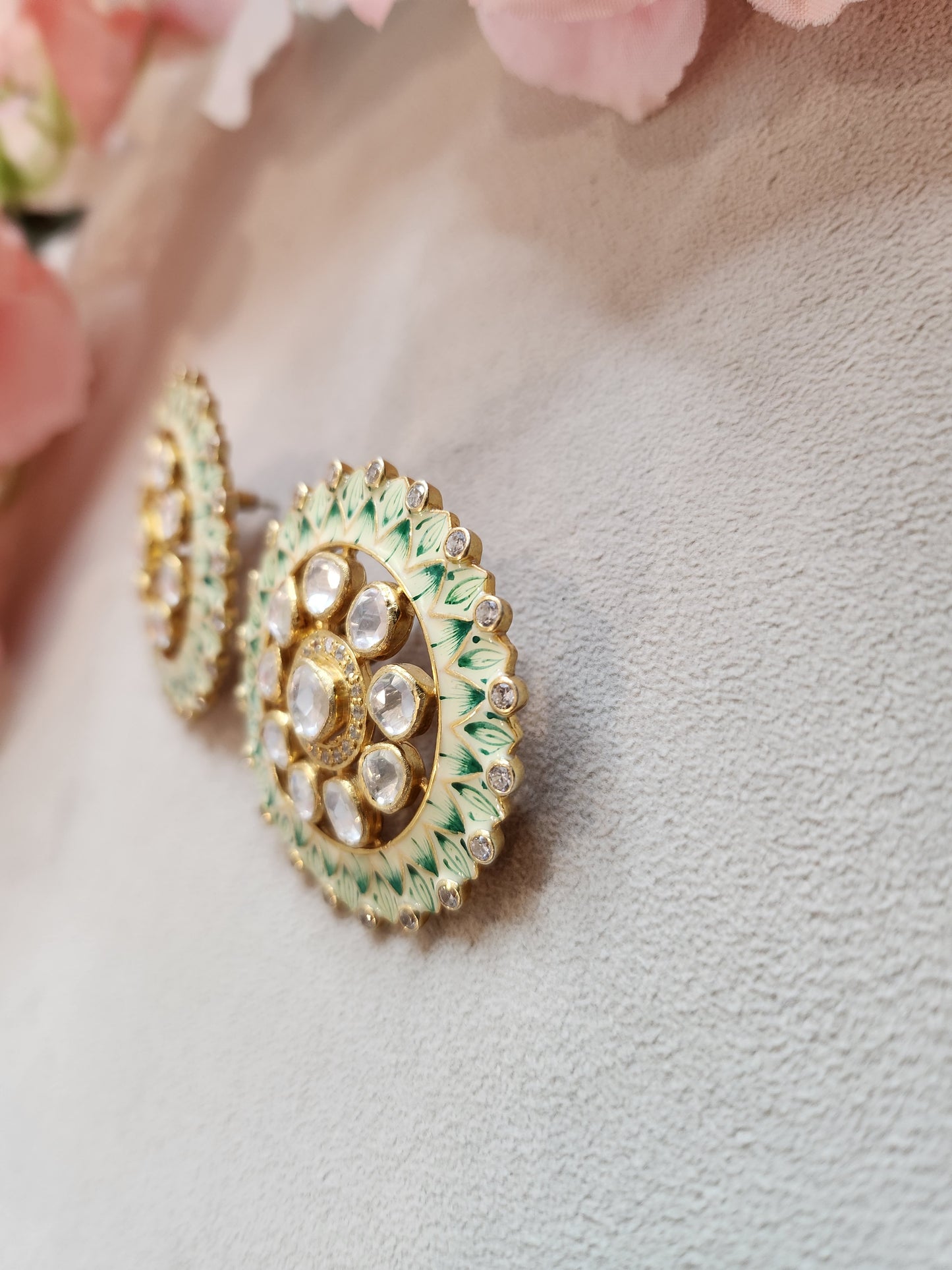 VINANTI MANJI JEWELRY - Featuring a pair of gold finish round earrings studded