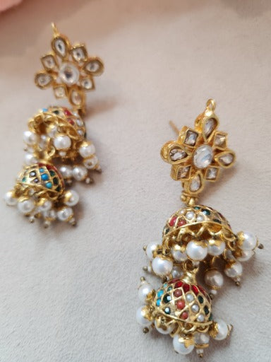 VINANTI MANJI JEWELRY - Featuring a pair of gold finish jhumka earrings studded